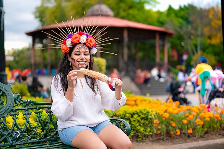 Girl eating corn in Coyoacán